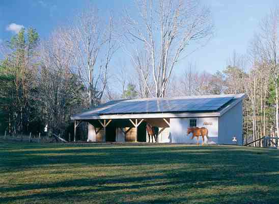 The stable’s sloped roof is the perfect location for photovoltaic panels, which generate much of the electricity needed to power the home’s geothermal pumps and other electrical needs.